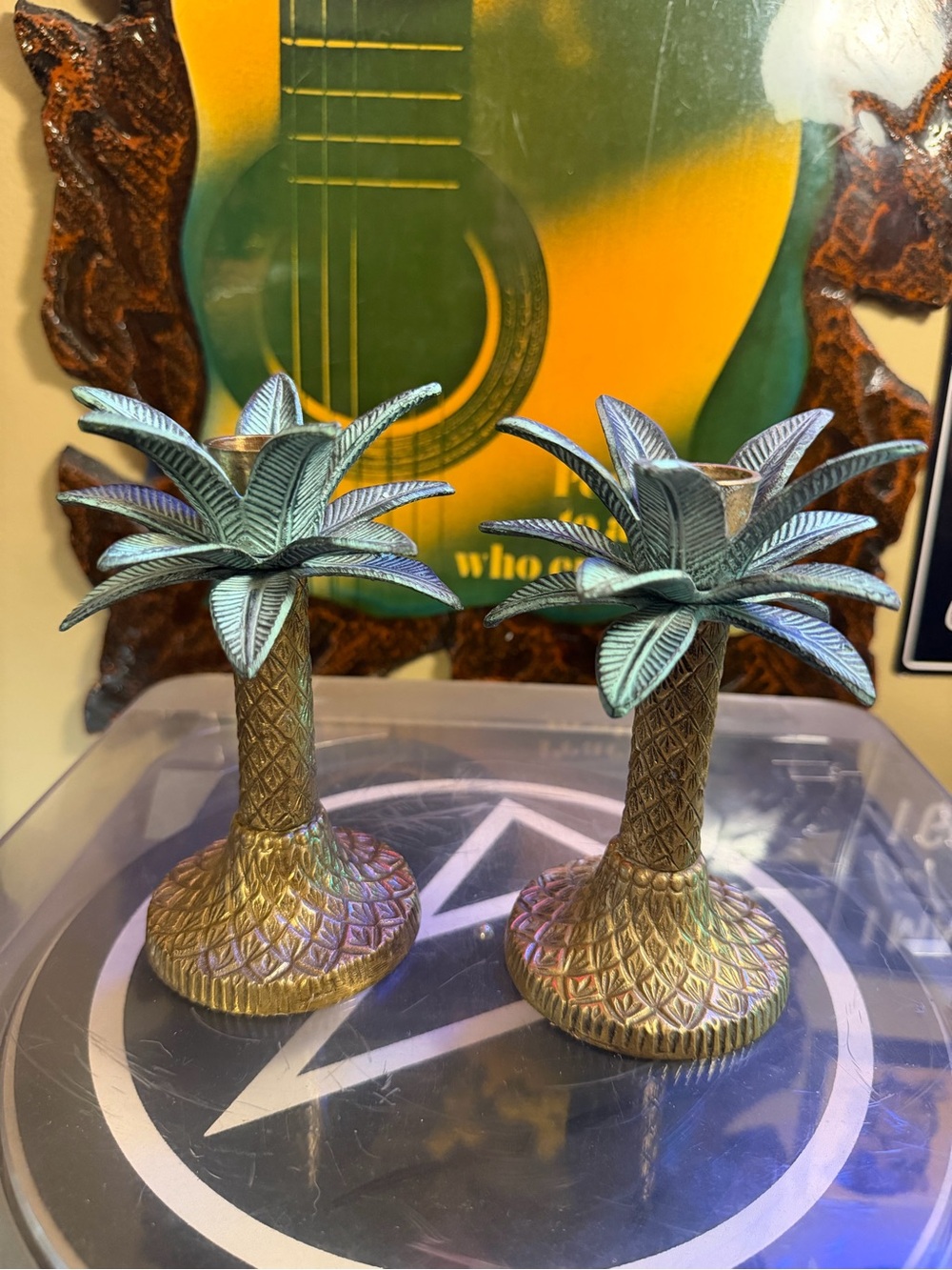 Vintage brass and patinated metal palm tree candle holders.